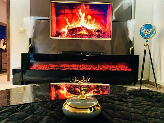 Electric fireplaces. Flame-effect fireplaces under the TV for cold Murree evenings or just for the mood.