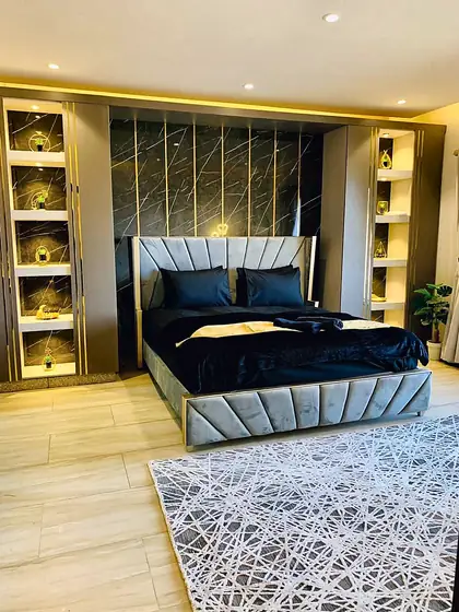 Full view of the bedroom with illuminated niches.