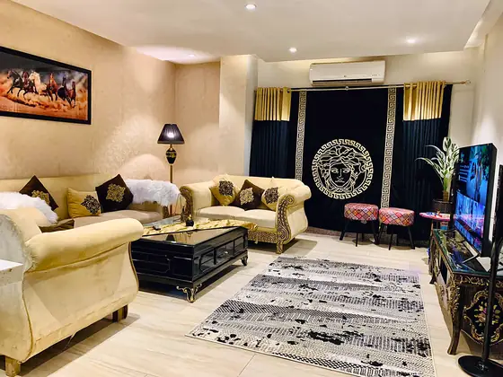 Royal Gold: Carved gold bed frame, black velvet and a terrace with city views