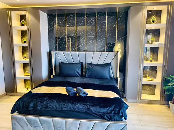 Photo 3 of Noir & Gold: Designer Furnished Apartment in Black Velvet and Marble