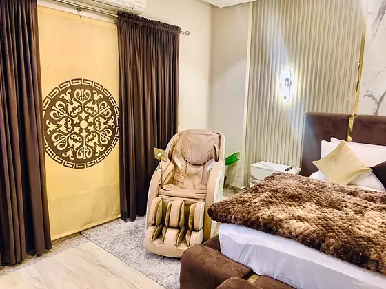 Photo 5 of Cocoa Suite: Furnished Apartment with Massage Chair and Marble Accents